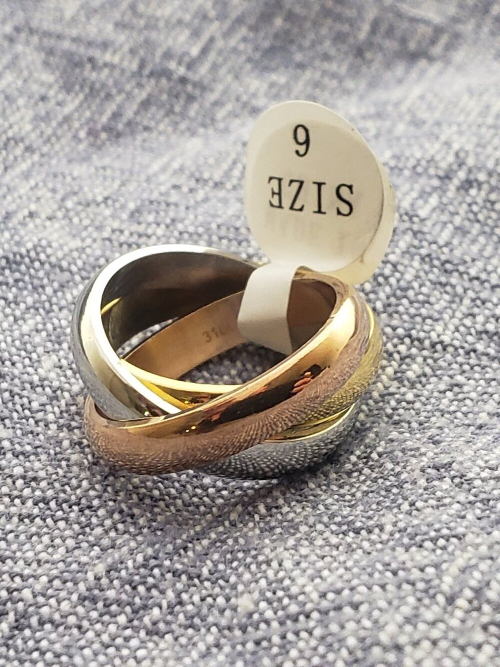 Stainless steel tri color, tri band comfort fit rings in sizes 6, 7, 8, 9